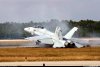 F18 Super Hornet slides off Pensacola NAS runway after blown tire.jpg